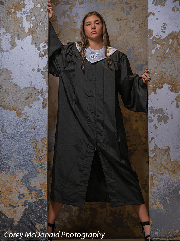 Caspian Silver and Beige Weathered Texture, photography backdrop panel for Denny StudioEdge silicone edge frame, shown with a senior girl in a black graduation gown with an arm raised looking downward SECP-8856