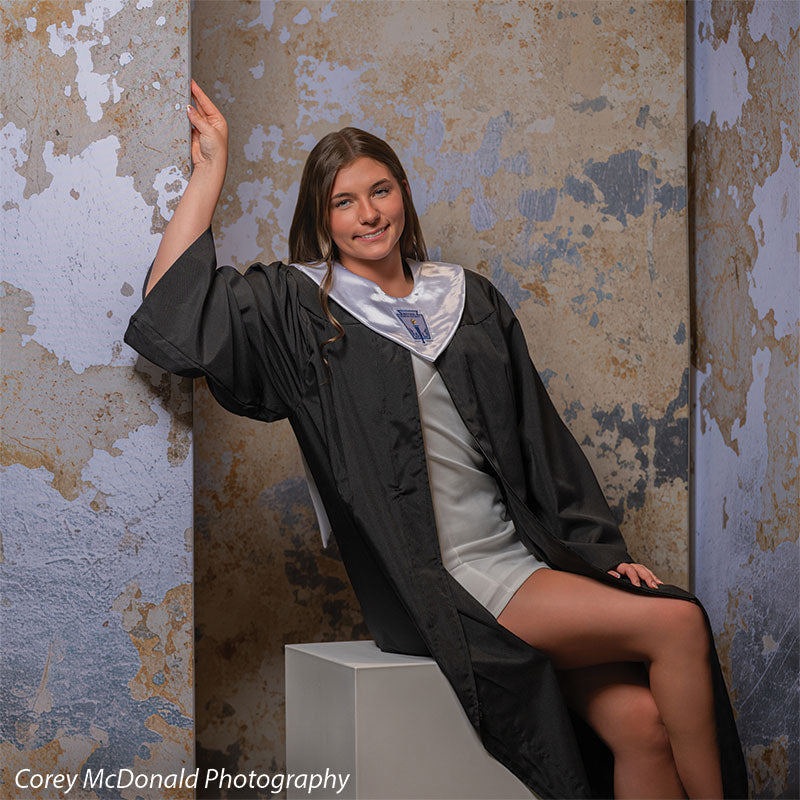 Caspian Silver and Beige Weathered Texture, photography backdrop panel for Denny StudioEdge silicone edge frame, shown with a senior girl in a graduation gown on a white posing cube with an arm raised SECP-8856