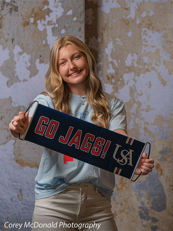 Caspian Silver and Beige Weathered Texture, photography backdrop panel for Denny StudioEdge silicone edge frame, shown with a senior girl smiling while holding a Go Jags banner SECP-8856