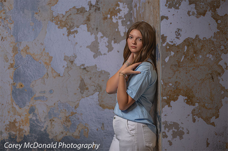 Caspian Silver and Beige Weathered Texture, photography backdrop panel for Denny StudioEdge silicone edge frame, shown with a senior girl in a blue tee with a hand on her shoulder in a side pose SECP-8856