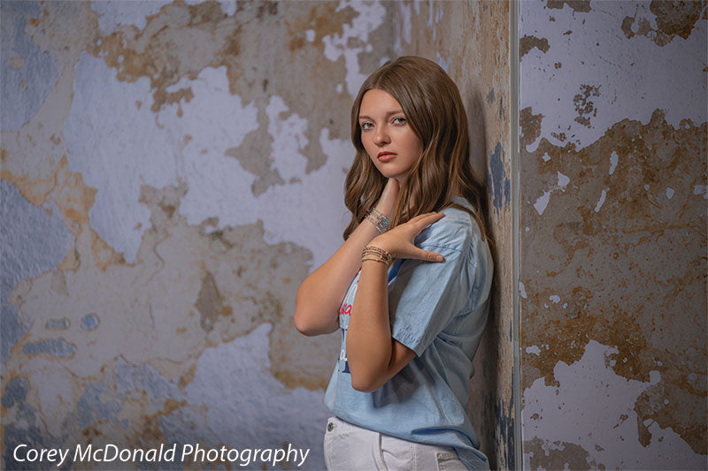 Caspian Silver and Beige Weathered Texture, photography backdrop panel for Denny StudioEdge silicone edge frame, shown with a senior girl in a light blue tee with a hand at her shoulder SECP-8856