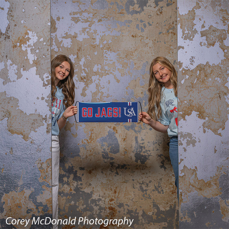 Caspian Silver and Beige Weathered Texture, photography backdrop panel for Denny StudioEdge silicone edge frame, shown with two senior girls holding a Go Jags banner between them SECP-8856