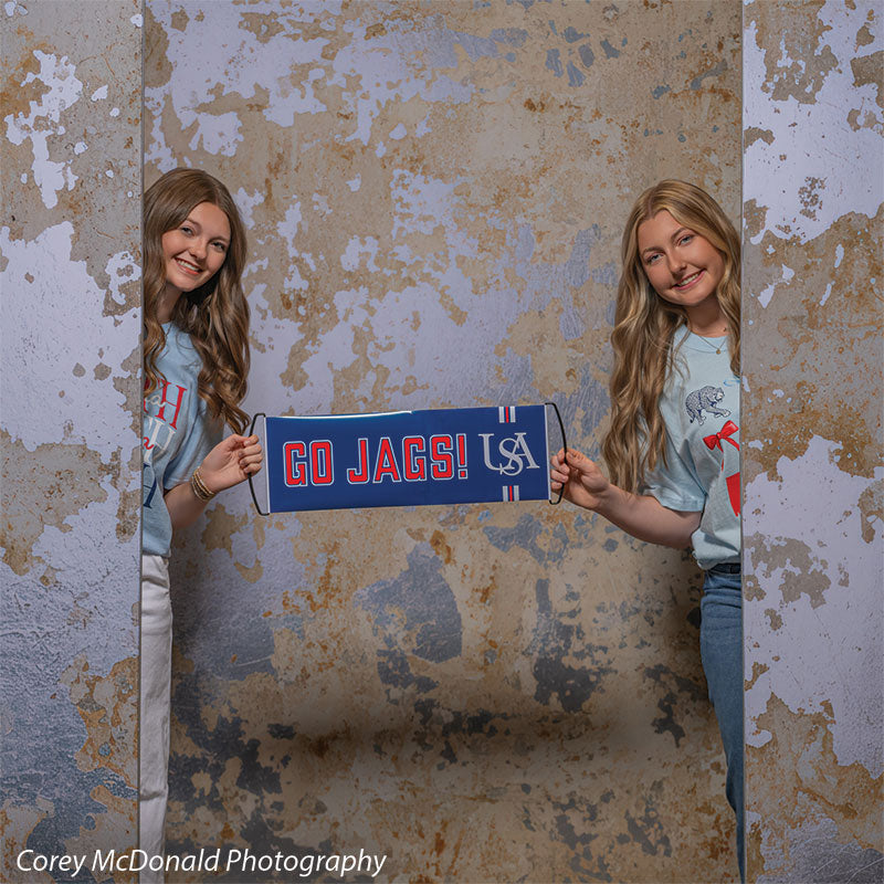 Caspian Silver and Beige Weathered Texture, photography backdrop panel for Denny StudioEdge silicone edge frame, shown with two senior girls holding a Go Jags banner SECP-8856