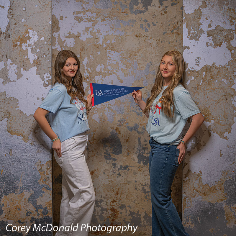 Caspian Silver and Beige Weathered Texture, photography backdrop panel for Denny StudioEdge silicone edge frame, shown with two senior girls holding a University of South Alabama pennant SECP-8856