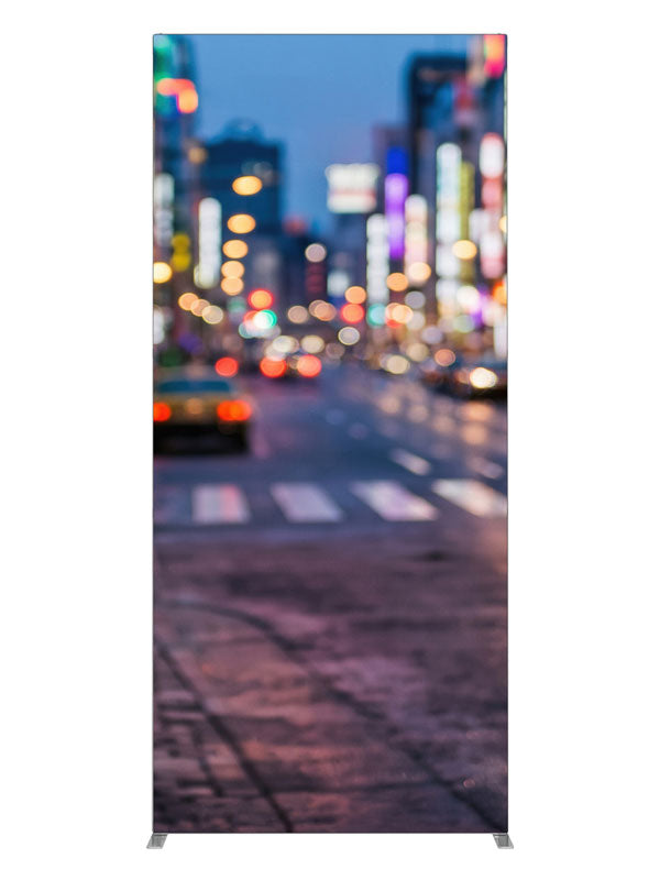 A city street at dusk blurred into multicolored out-of-focus light orbs over a reflective road, 3ft photography backdrop panel for Denny StudioEdge silicone edge frame