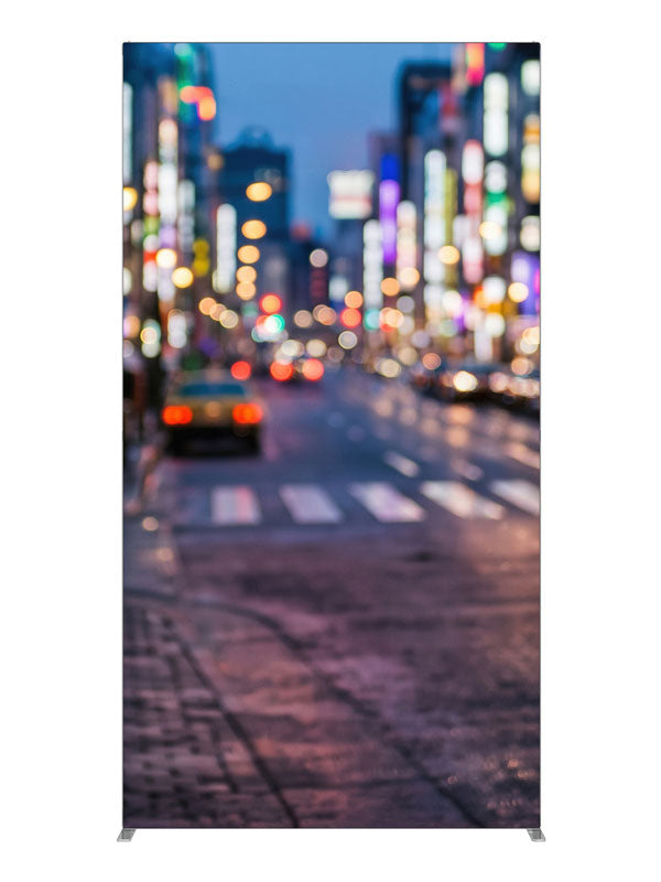 A city street at dusk blurred into multicolored out-of-focus light orbs over a reflective road, 4ft photography backdrop panel for Denny StudioEdge silicone edge frame