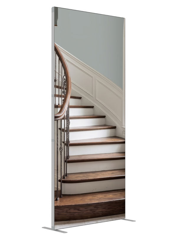 A light curved staircase with iron scroll balusters, white wainscot and a tall arched window, 3ft photography backdrop panel for Denny StudioEdge silicone edge frame, angled view