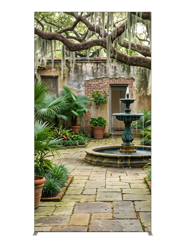 An enclosed courtyard with a tiered fountain, potted palms and aged walls under a moss-draped oak, 4ft photography backdrop panel for Denny StudioEdge silicone edge frame