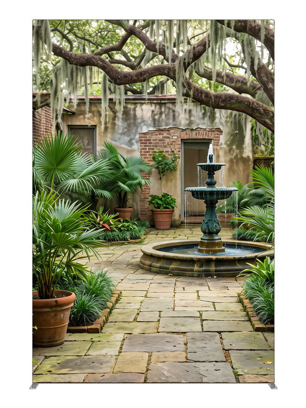 An enclosed courtyard with a tiered fountain, potted palms and aged walls under a moss-draped oak, 5ft photography backdrop panel for Denny StudioEdge silicone edge frame