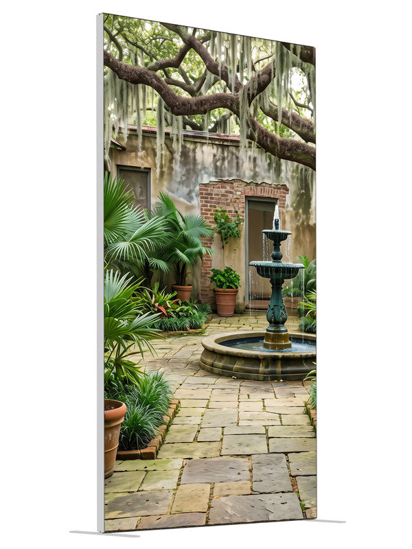An enclosed courtyard with a tiered fountain, potted palms and aged walls under a moss-draped oak, 4ft photography backdrop panel for Denny StudioEdge silicone edge frame, angled view