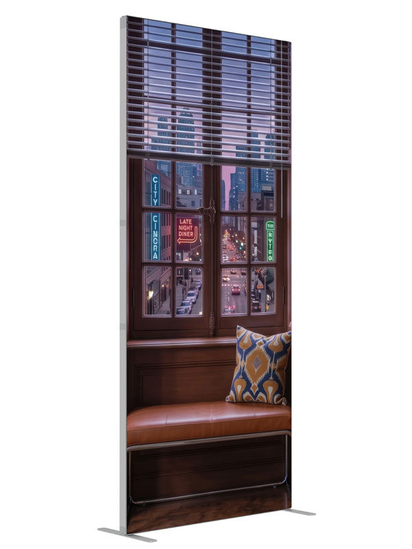 A warm wood-paneled room with a tall window overlooking a neon-lit downtown street at dusk, 3ft photography backdrop panel for Denny StudioEdge silicone edge frame, angled view