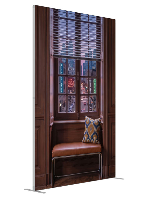 A warm wood-paneled room with a tall window overlooking a neon-lit downtown street at dusk, 5ft photography backdrop panel for Denny StudioEdge silicone edge frame, angled view