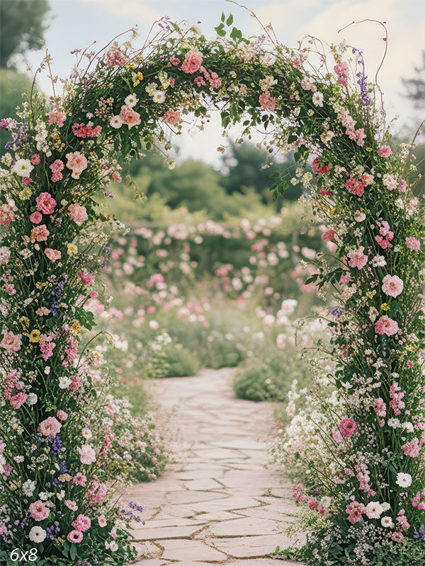 A blooming floral arch of roses and vines frames a winding stone path through a lush, pastel garden.
