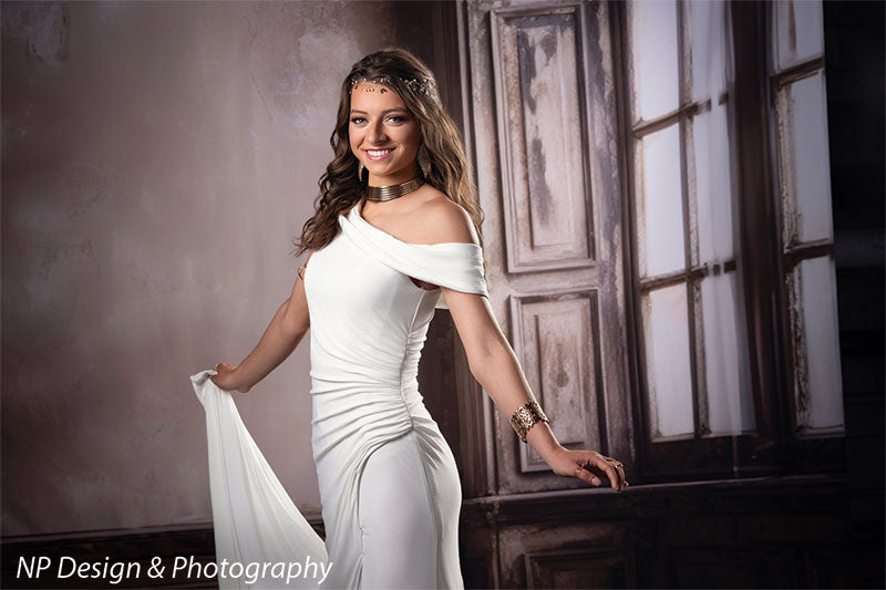 French beige foyer photography backdrop shown with a young woman in a white gown holding her skirt beside the window, smiling CP-8500