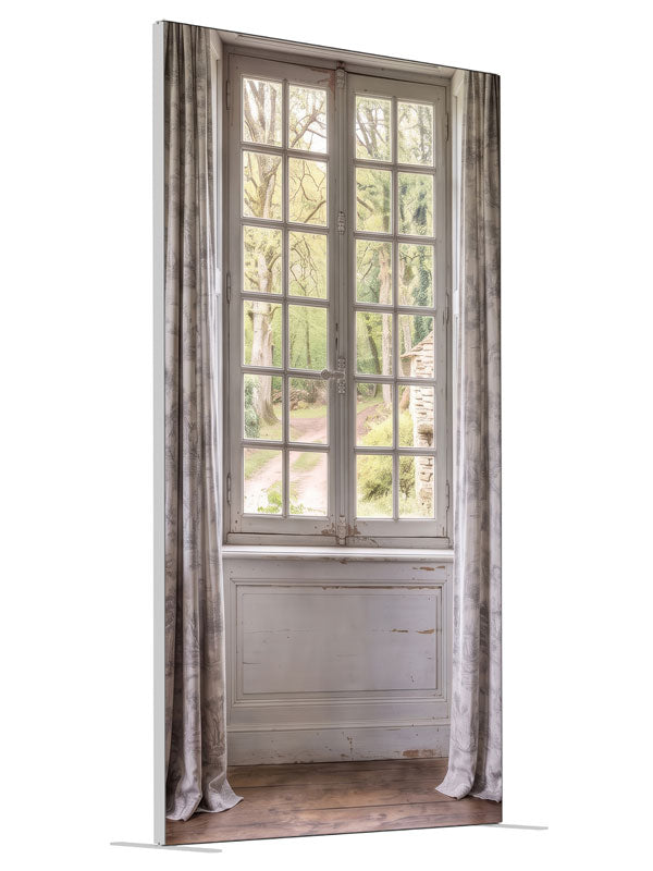 A pale blue-gray French country room with a window onto a spring garden and stone cottage, 4ft photography backdrop panel for Denny StudioEdge silicone edge frame, angled view