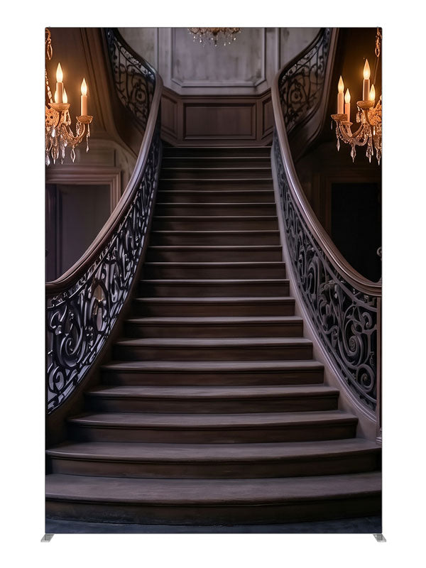 An opulent mansion foyer staircase with iron scroll railings and lit crystal chandeliers, 5ft photography backdrop panel for Denny StudioEdge silicone edge frame
