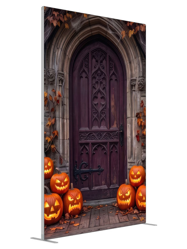Cobwebbed Gothic arched door in weathered stone with glowing jack-o'-lanterns at the base, 5ft photography backdrop panel for Denny StudioEdge silicone edge frame, angled view