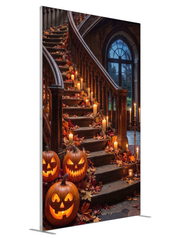 Ornate curved manor staircase dressed with glowing jack-o'-lanterns, candles, and autumn leaves, 5ft photography backdrop panel for Denny StudioEdge silicone edge frame, angled view