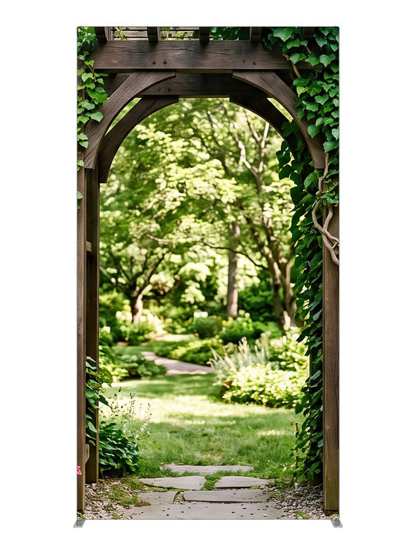 Dark timber and dry-stacked stone garden arbor under heavy ivy opening onto a sunlit lawn, 4ft photography backdrop panel for Denny StudioEdge silicone edge frame
