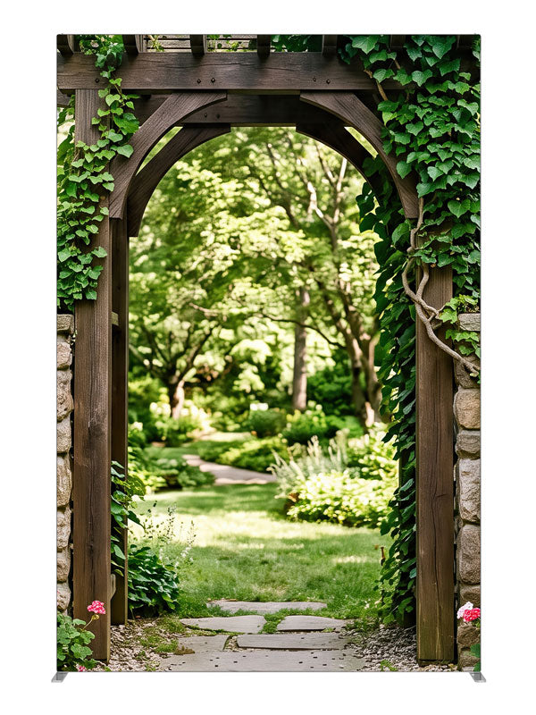 Dark timber and dry-stacked stone garden arbor under heavy ivy opening onto a sunlit lawn, 5ft photography backdrop panel for Denny StudioEdge silicone edge frame