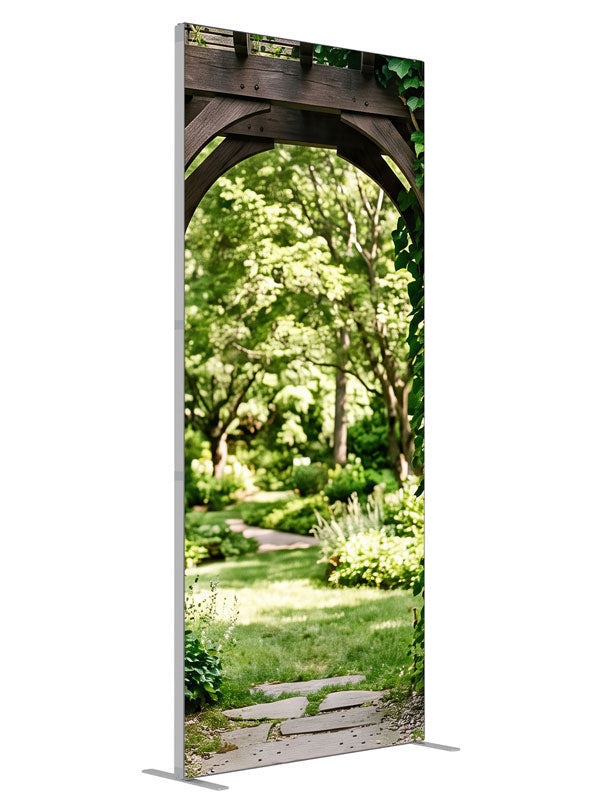 Dark timber and dry-stacked stone garden arbor under heavy ivy opening onto a sunlit lawn, 3ft photography backdrop panel for Denny StudioEdge silicone edge frame, angled view