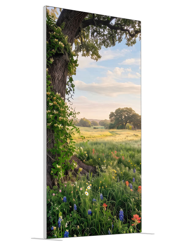 Spreading live oak wrapped in honeysuckle vine above a meadow of bluebonnets and red paintbrush wildflowers, 4ft photography backdrop panel for Denny StudioEdge silicone edge frame, angled view