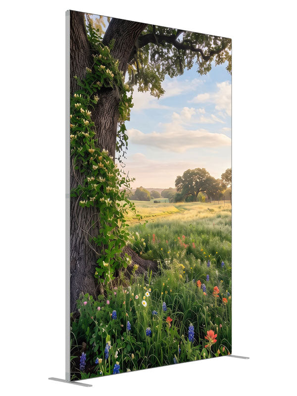 Spreading live oak wrapped in honeysuckle vine above a meadow of bluebonnets and red paintbrush wildflowers, 5ft photography backdrop panel for Denny StudioEdge silicone edge frame, angled view