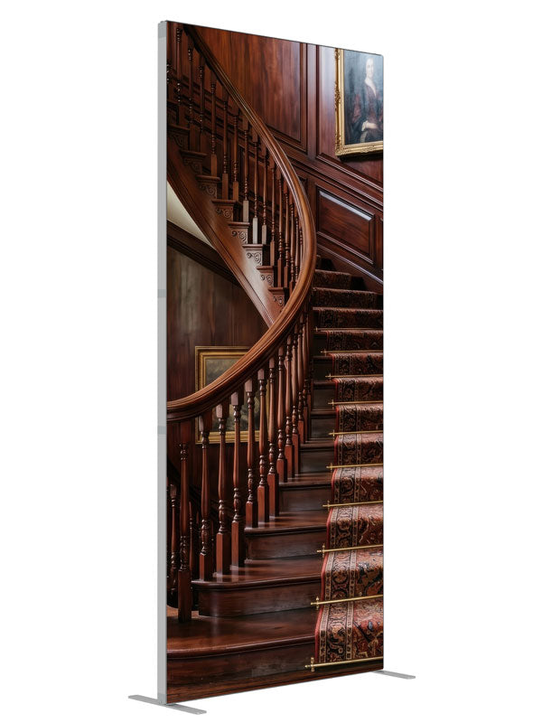 A mahogany curved staircase with turned balusters, a patterned runner and paneled walls hung with portraits, 3ft photography backdrop panel for Denny StudioEdge silicone edge frame, angled view
