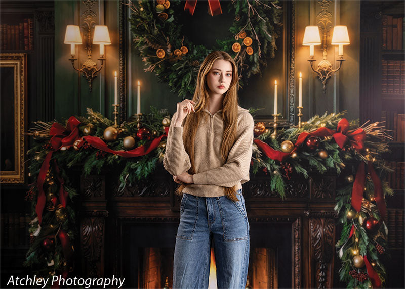 Manor Hearth dark wood fireplace with Christmas wreath photography backdrop shown with a senior girl standing in a relaxed pose by the fireplace, wide view CP-8885