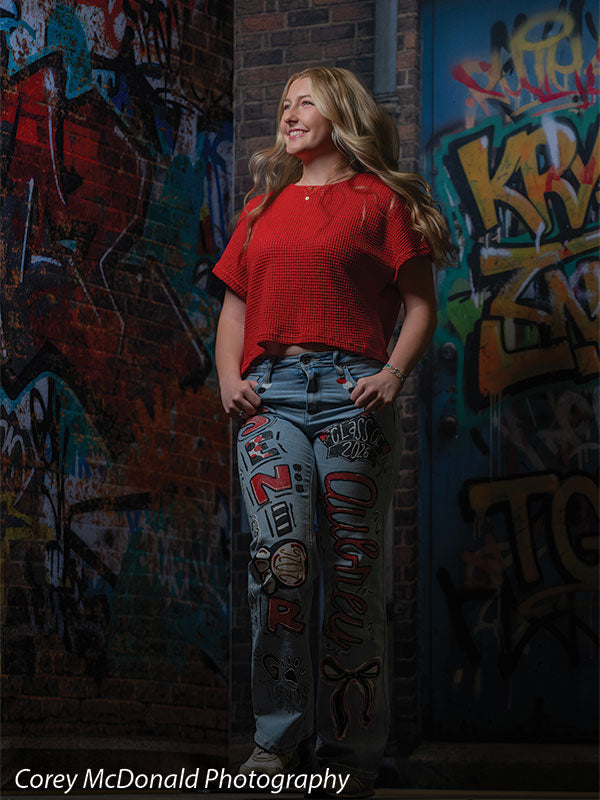 Marlowe Brick Wall Graffiti, photography backdrop panel for Denny StudioEdge silicone edge frame, shown with a senior girl in a red top standing with a hand on her hip SECP-8863