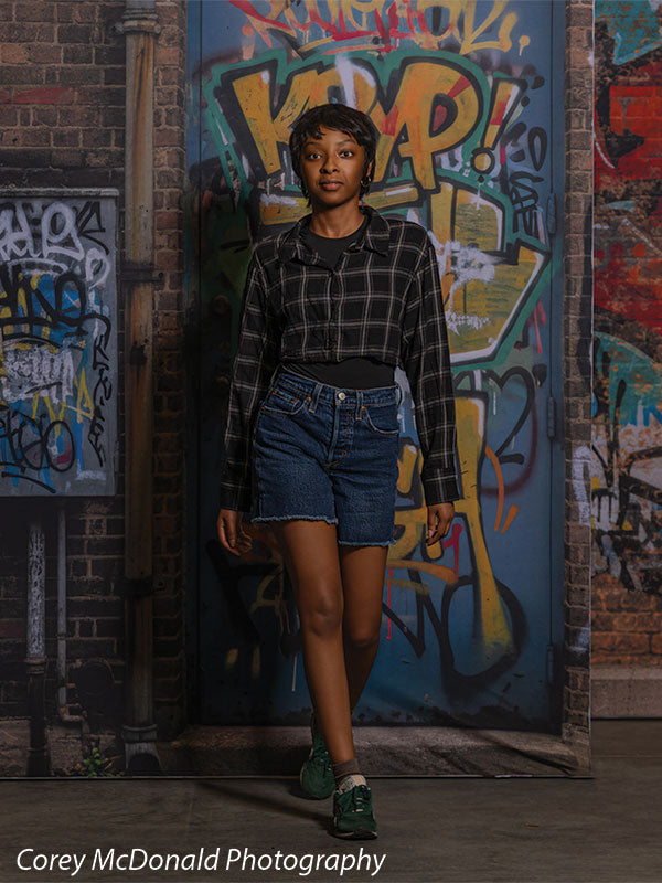 Marlowe Brick Wall Graffiti, photography backdrop panel for Denny StudioEdge silicone edge frame, shown with a senior girl stepping forward in front of the graffiti wall SECP-8863