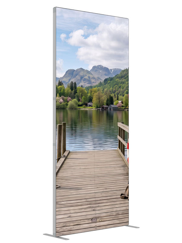 Weathered wooden dock running out into a calm mountain lake with a moored rowboat and a forested far shore, 3ft photography backdrop panel for Denny StudioEdge silicone edge frame, angled view