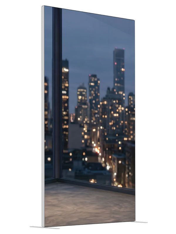 An empty modern room corner with windows over a softly blurred nighttime city skyline, 4ft photography backdrop panel for Denny StudioEdge silicone edge frame, angled view