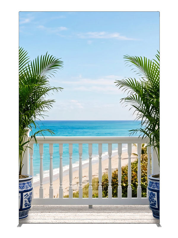 A white seaside deck with a spindle railing and porcelain palm planters over turquoise ocean, 5ft photography backdrop panel for Denny StudioEdge silicone edge frame