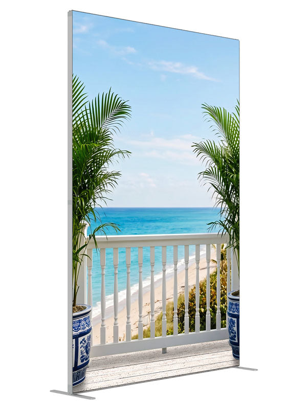 A white seaside deck with a spindle railing and porcelain palm planters over turquoise ocean, 5ft photography backdrop panel for Denny StudioEdge silicone edge frame, angled view