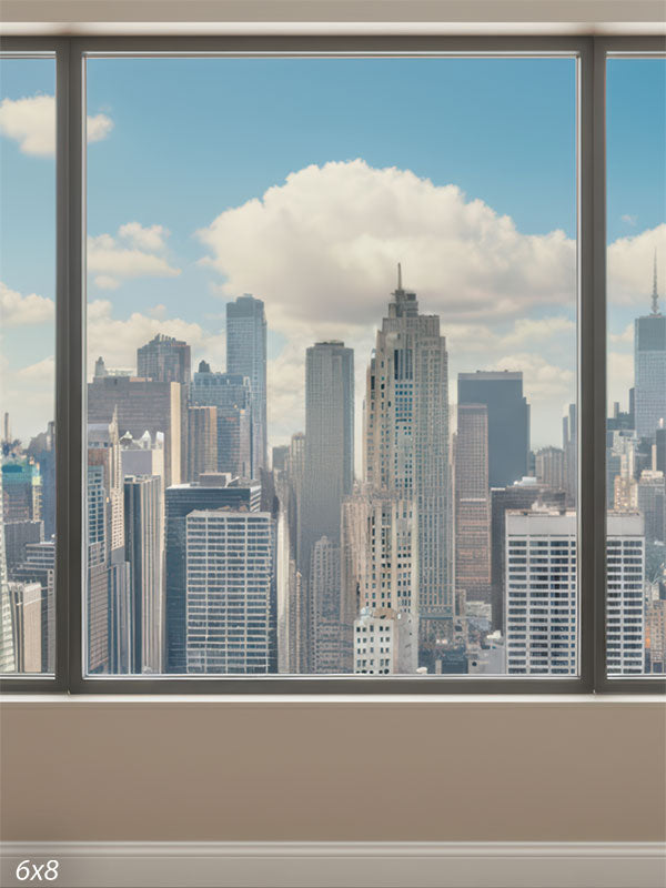 Vertical view of a modern city skyline seen through tall floor-to-ceiling office windows with a neutral beige sill and bright blue sky with soft clouds.
