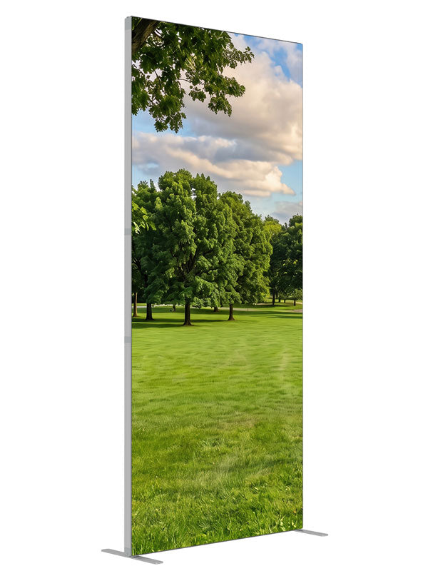 A broad open park lawn with a large shade tree and a distant tree line under a cloud-dotted sky, 3ft photography backdrop panel for Denny StudioEdge silicone edge frame, angled view