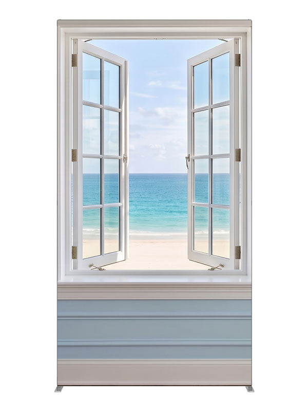 A white casement window open in a pale blue paneled wall onto a turquoise beach and sky, 4ft photography backdrop panel for Denny StudioEdge silicone edge frame