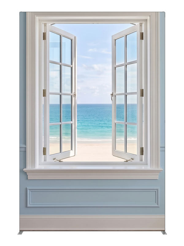 A white casement window open in a pale blue paneled wall onto a turquoise beach and sky, 5ft photography backdrop panel for Denny StudioEdge silicone edge frame