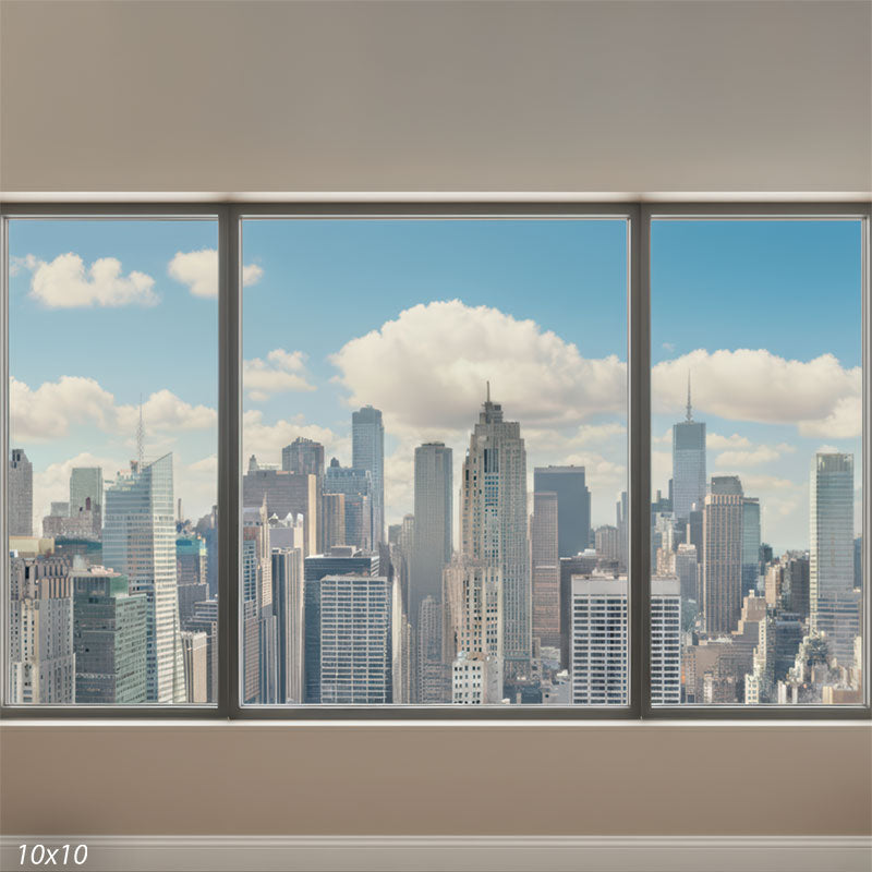 Wide panoramic backdrop showing three large office windows framing a detailed skyscraper skyline under a clear blue sky, with a simple neutral interior wall below.