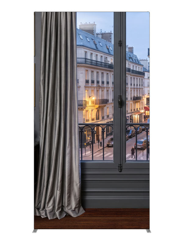 A charcoal Parisian apartment with a French window and iron balcony over a Haussmann street at dusk, 4ft photography backdrop panel for Denny StudioEdge silicone edge frame