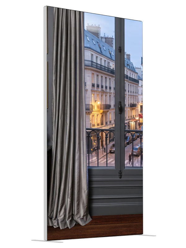 A charcoal Parisian apartment with a French window and iron balcony over a Haussmann street at dusk, 4ft photography backdrop panel for Denny StudioEdge silicone edge frame, angled view