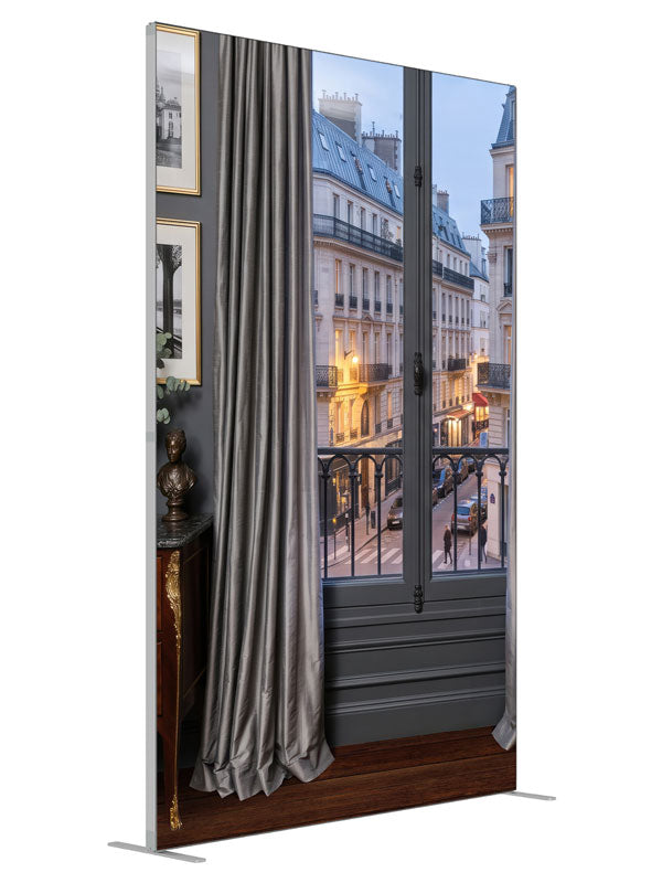 A charcoal Parisian apartment with a French window and iron balcony over a Haussmann street at dusk, 5ft photography backdrop panel for Denny StudioEdge silicone edge frame, angled view
