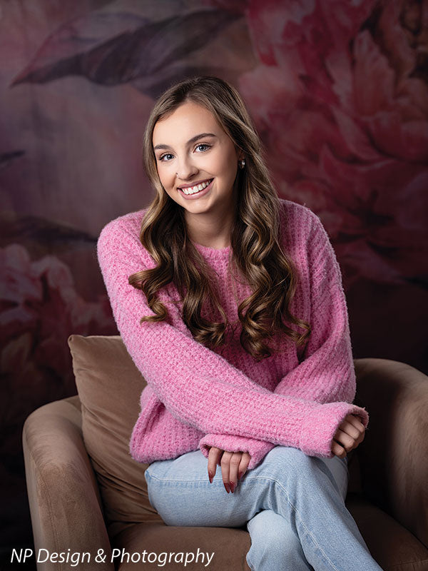 Peony bliss floral photography backdrop shown with seated in a brown armchair with her hands on her knee CP-8226