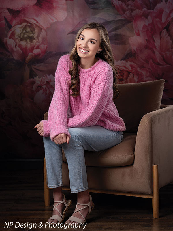 Peony bliss floral photography backdrop shown with perched on the arm of a chair in a full-length pose CP-8226