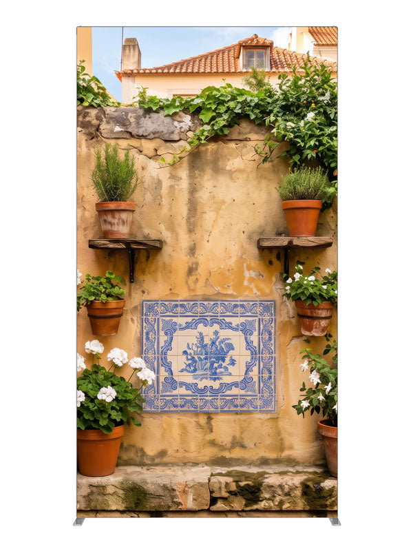 A warm ochre plaster wall with blue-and-white Portuguese tiles and potted geraniums, 4ft photography backdrop panel for Denny StudioEdge silicone edge frame