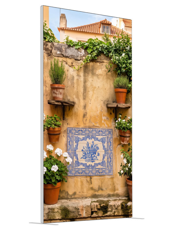 A warm ochre plaster wall with blue-and-white Portuguese tiles and potted geraniums, 4ft photography backdrop panel for Denny StudioEdge silicone edge frame, angled view