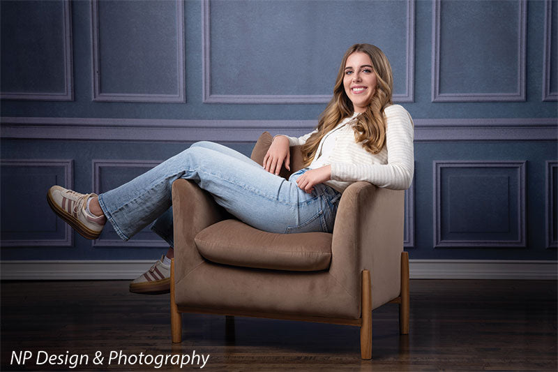 Princess grace photography backdrop shown with lounging in a brown armchair with her legs up in a full-length pose CP-7810