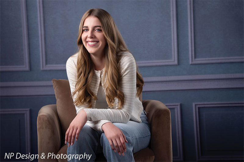 Princess grace photography backdrop shown with seated in a brown armchair smiling CP-7810