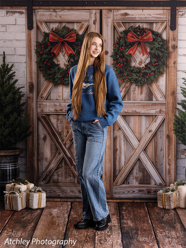 Reclaimed wood photography floor drop shown with a senior girl standing full-length on the reclaimed wood floor in a barn-door scene FD-4070